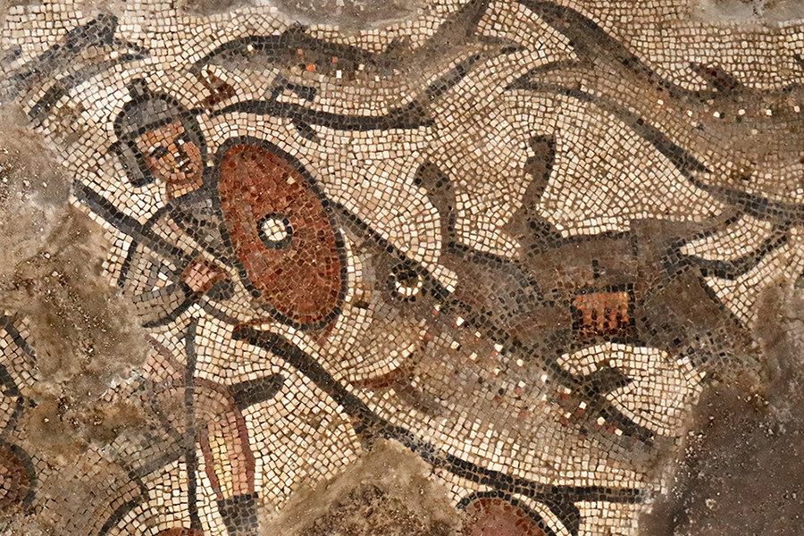 Dr. Karen Britt researches ancient mosaics as part of an excavation team that has uncovered artwork such as this depiction of a fish swallowing one of Pharaoh’s soldiers. (Submitted photo by Jim Haberman)