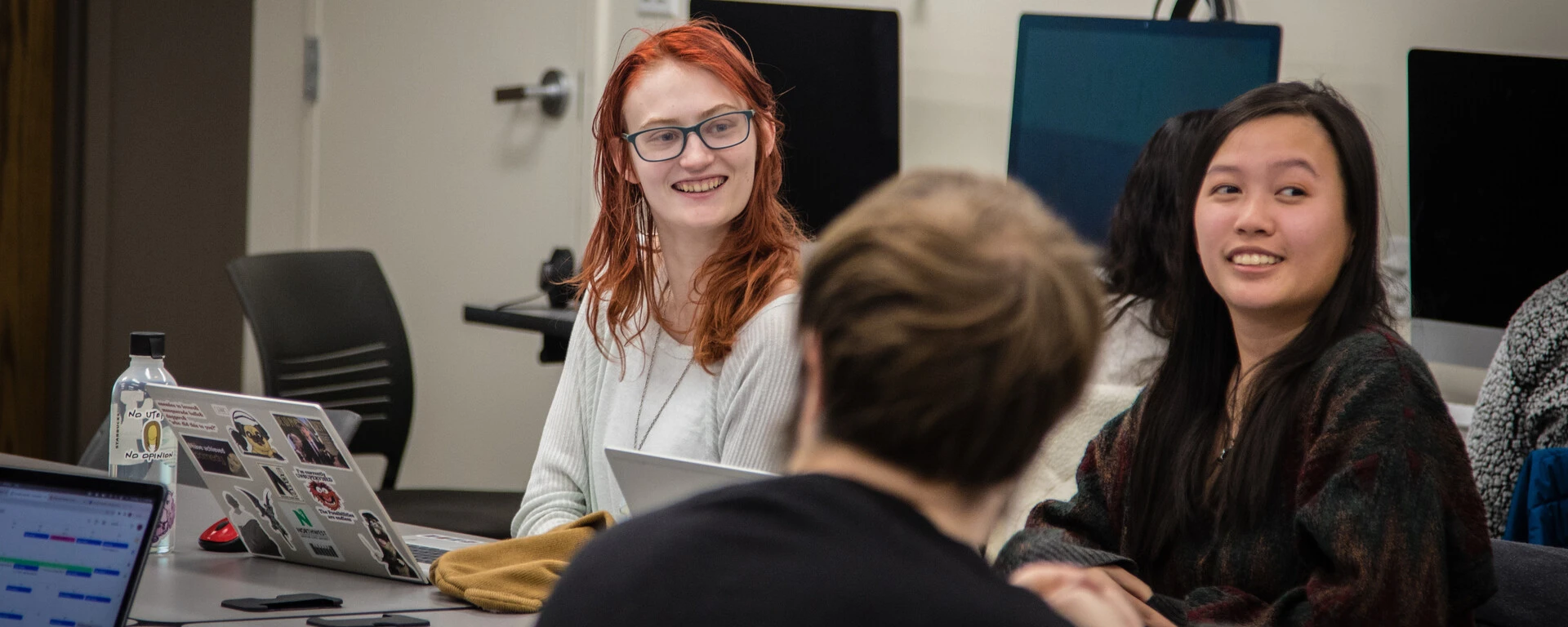 Four students sitting at a table during a meeting or study session at Northwest Missouri State University