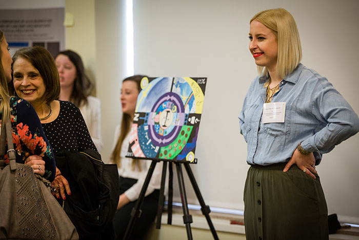 Alana Kay Hollingsworth, an elementary education major from Smithville, Missouri, presented her painting, “Ecology,” during last year's Celebration of Quality. As an art minor, Hollingsworth used painting to depict her ecology as a teacher. (Photos by Toddd Weddle/Northwest Missouri State University)