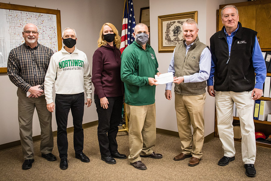 Left to right, as Nodaway County commissioners presented a check to Northwest representatives Thursday in support of the University's Agricultural Learning Center, are Commissioner Bill Walker; Northwest President Dr. John Jasinski; Mitzi Marchant, Northwest's director of donor engagement; Rod Barr, director of Northwest's School of Agricultural Sciences; Commissioner Chris Burns; and Commissioner Scott Walk. (Photo by Brandon Bland/Northwest Missouri State University)