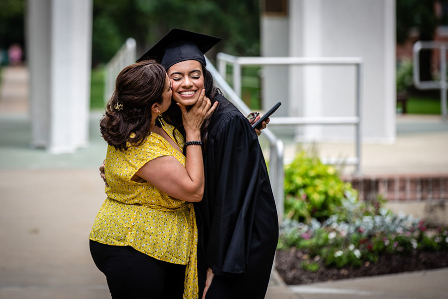 A Northwest graduate shares a moment with a loved one before the University's commencement ceremony last spring. Northwest hosts its 2021 spring commencement ceremonies May 6-8. (Photos by Todd Weddle/Northwest Missouri State University)