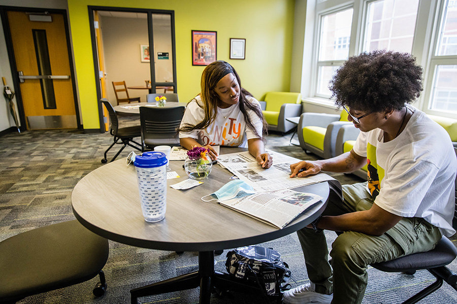 Northwest students Dwan’yel Iverson and Rashawn Brown read a newspaper in the newly remodeled Office of Diversity and Inclusion, which now includes study spaces, conference areas for organizational meetings and collaboration, and lounge areas. (Photos by Todd Weddle/Northwest Missouri State University)
