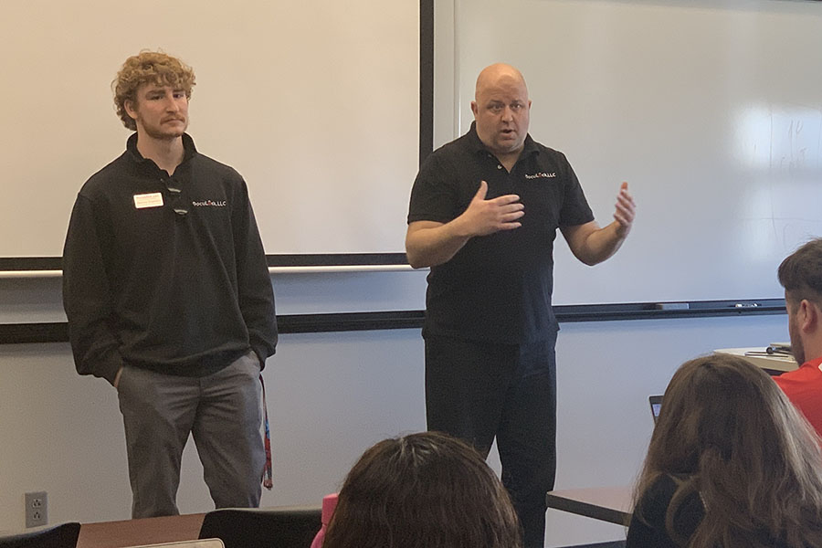 Spencer Engelman, left, and Paul Janicek talked with Northwest business students on Monday about the opportunity to receive a DocuLock franchise through a partnership with Northwest. (Northwest Missouri State University photo)