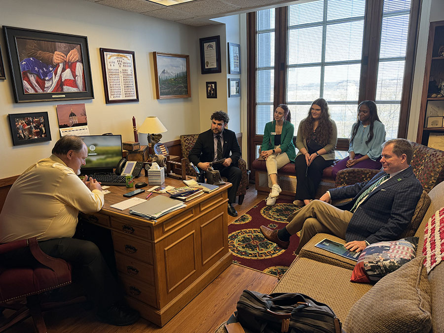 Northwest President Dr. Lance Tatum (right) joined students as they met with state lawmakers.