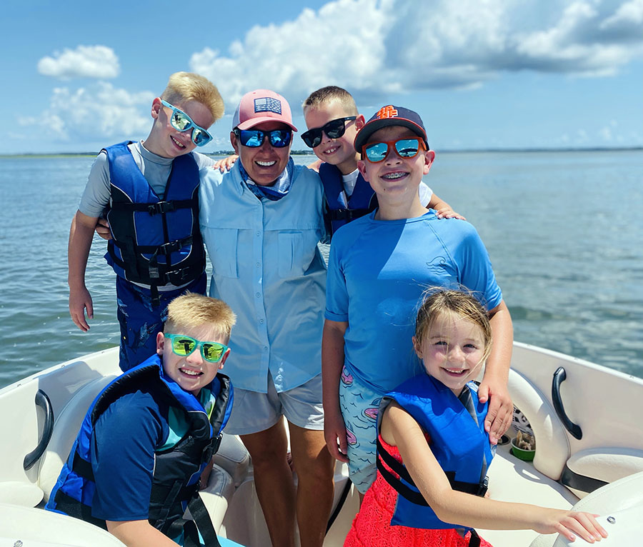 Megan McLaughlin (center) enjoys creating fun for families as the owner of Island Time Charters.