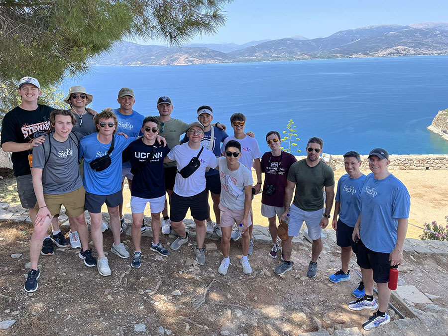 Max Kneib (second from left in the front row) is pictured with his travel group at the top of the fortress of Palamidi, overlooking the Argolic Gulf. Kneib was one of 17 undergraduate students selected to join the Greek travel experience with Sigma Phi Epsilon alumni mentors and university faculty. (Submitted photo)