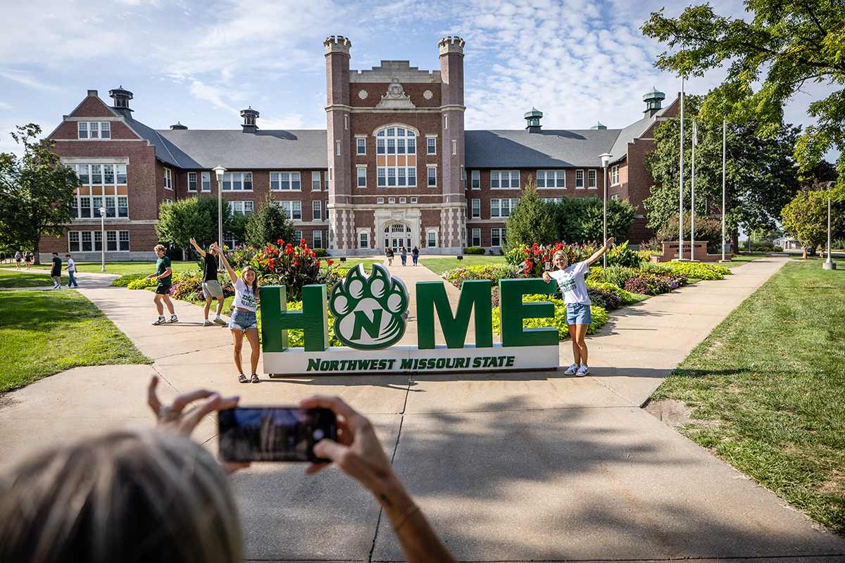 Students posed for photos in front of Northwest's Administration Building as they arrived to begin the fall semester in August. (Photo by Todd Weddle/Northwest Missouri State University)