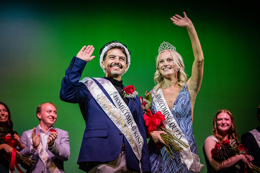 Sal Bonadonna and Chloe DeVries wave to audience members at Thursday night's Variety Show after they were crowned Homecoming king and queen. (Photo by Lilly Cook/Northwest Missouri State University)