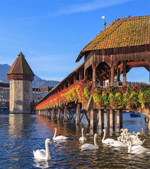 The next Tourin’ Bearcats experience features  the “Alpine Lakes and Scenic Trains” of Switzerland, including  the Chapel Bridge in Lucerne.