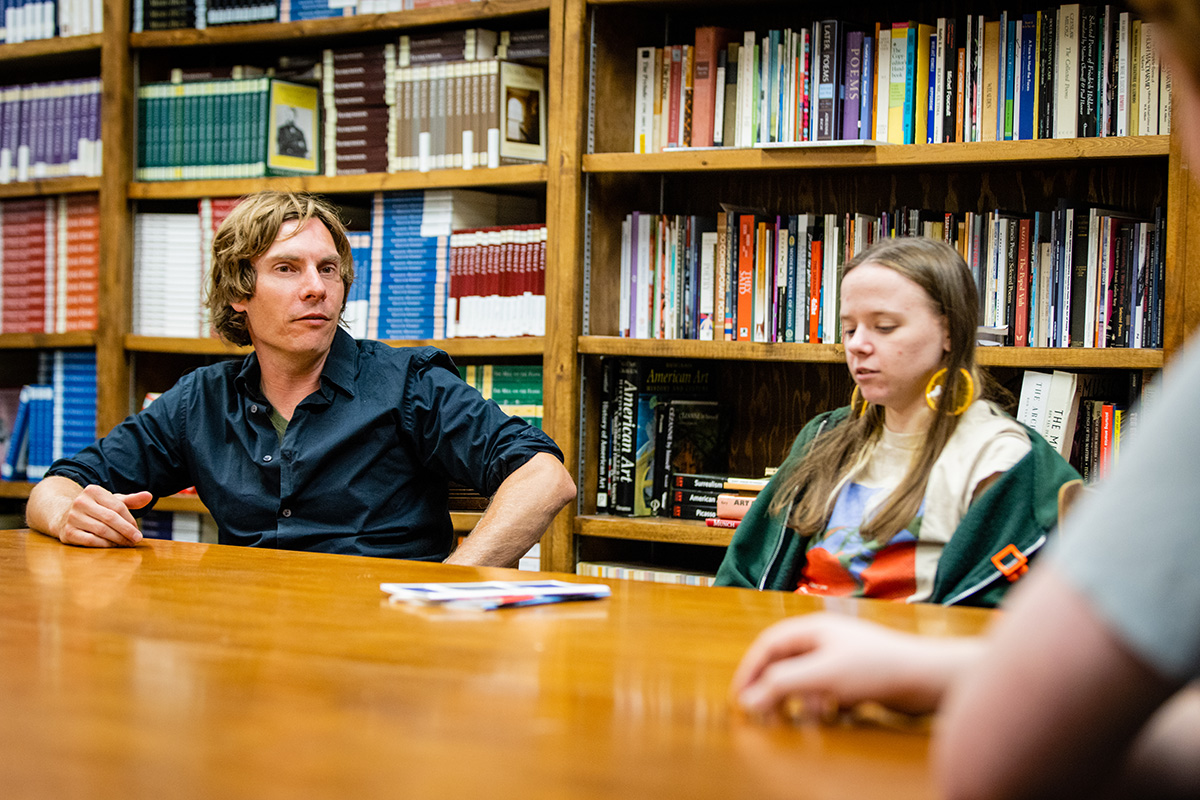 Luke Rolfes, an assistant professor of English at Northwest, is pictured in the office of the GreenTower Press, which has published the 13th volume “Proud To Be: Writing by American Warriors.” (Photo by Todd Weddle/Northwest Missouri State University) 