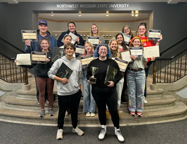 The Tower yearbook staff earned 14 awards at the Fall National Media Convention, including a Best in Show award and Yearbook of the Year.