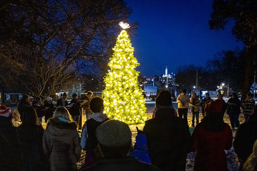 Community members are gathered around a tree during last year's President’s Tree Lighting. (Photo by Lauren Adams/Northwest Missouri State University)