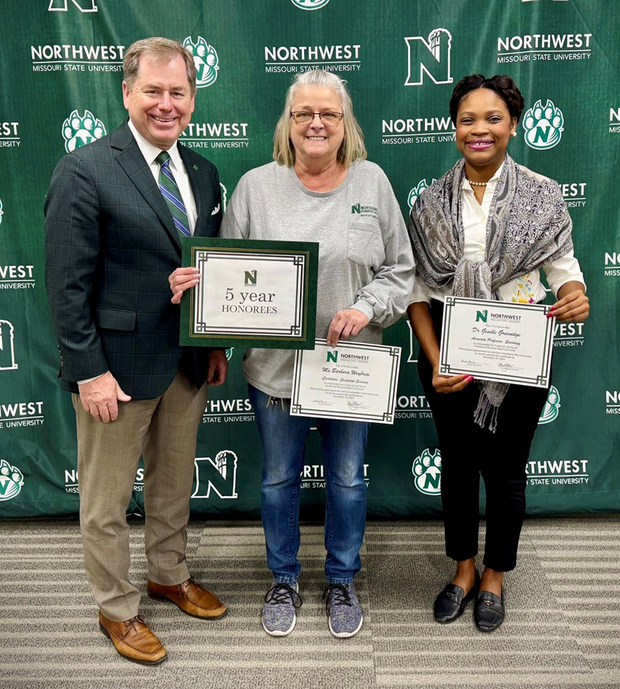 Pictured with Northwest President Dr. Lance Tatum are, left to right, Barbara Weybrew, first shift custodian for Facility Services, and Dr. Giselle Greenidge, associate professor of sociology in the School of Health Science and Wellness.