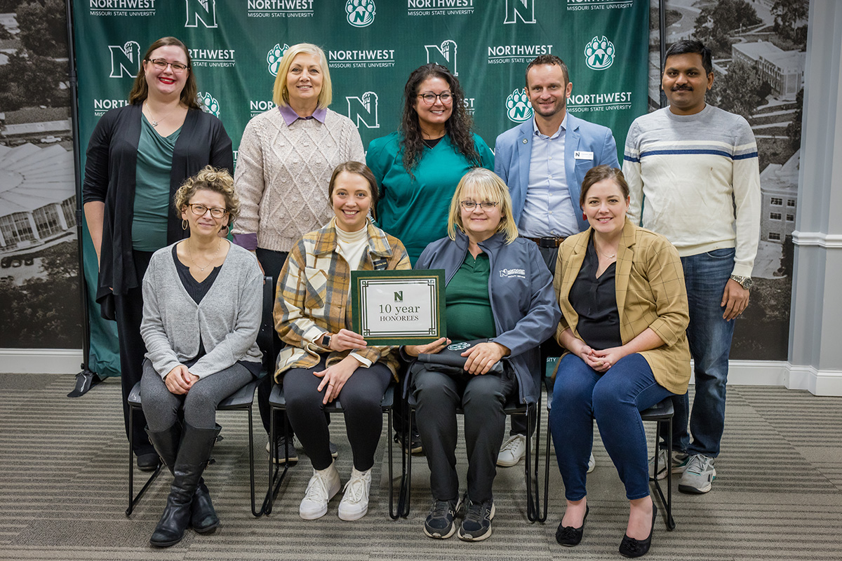 Pictured left to right in the front row are Katheryn Bilbo, associate professor of theatre, Department of Fine and Performing Arts; Samantha Cole, project assistant, Regional Professional Development Center; Tammy Murphy, first shift custodian, Facility Services; and Dr. Keely Cline, associate professor of psychology, School of Health Science and Wellness.
In the back row are Stephanie Jorandby, associate professor of theatre, Department of Fine and Performing Arts; Dr. Sandy Seipel, associate professor of professional education, School of Education; Rachel Peter, staff nurse, Wellness Services; Dr. Tyler Tapps, assistant vice president of student affairs for health and well-being, Wellness Services; and Dr. Ajay Bandi, associate professor of computer science and information systems, School of Computer Science and Information Systems.