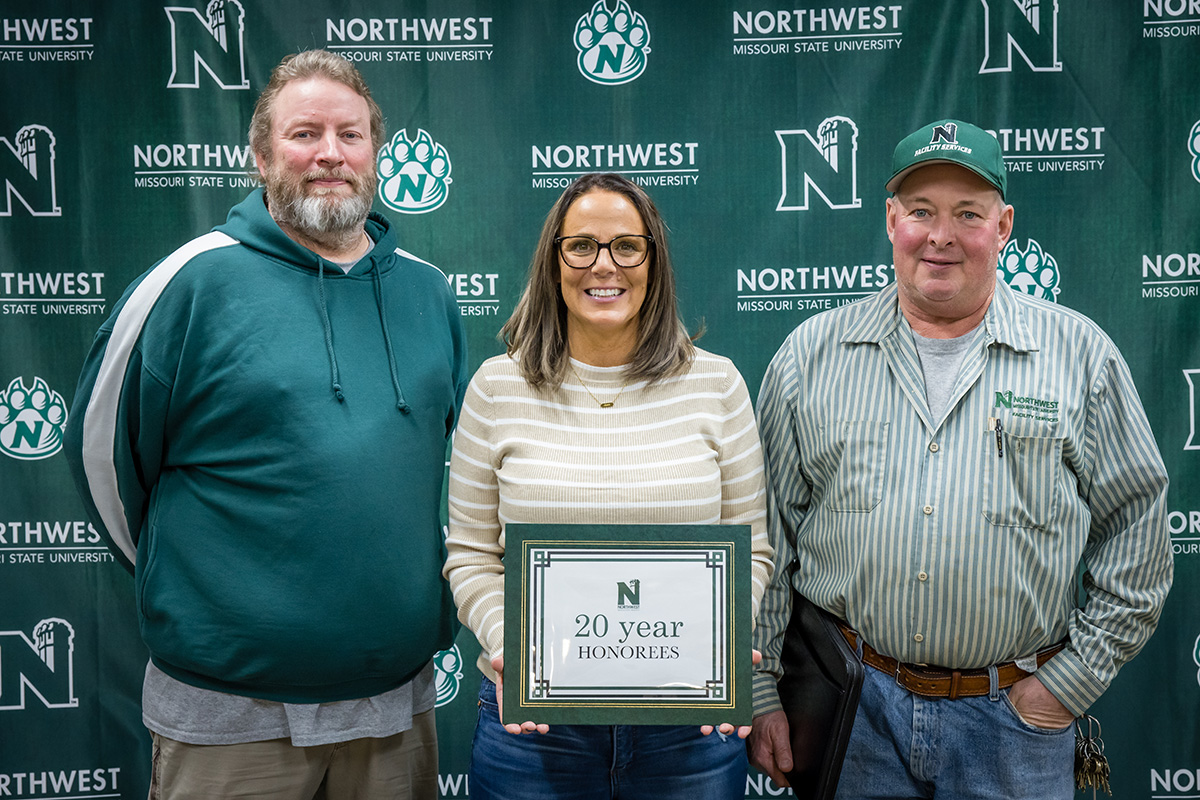 Pictured left to right are Mike Striplin, central receiving supervisor, Purchasing Office; Lisa Bishop, senior instructor of marketing, Melvin D. and Valorie G. Booth College of Business; and Jay Hart, plumber, Facility Services.